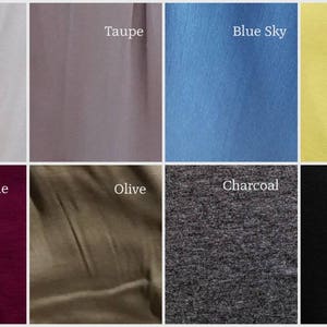 May include: A color palette featuring eight fabric swatches. Colors include ivory, taupe, blue sky, lemon, wine, olive, charcoal, and black. Each swatch is labeled with its respective color name in white text.