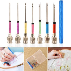 May include: A set of seven metal punch needles with colored shafts and numbered bases, accompanied by a blue textured handle and a clear plastic storage case. The needles are shown in use with embroidery hoops and fabric for needlework projects.