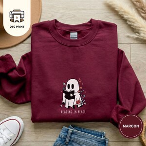 Halloween sweatshirt for bookish, funny Gildan 18000 design featuring a ghost and a book.