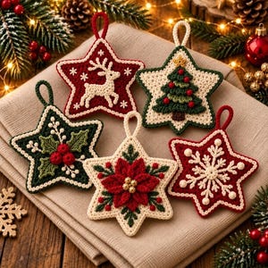 May include: Five star-shaped crochet ornaments featuring holiday designs: a white reindeer on red, a green Christmas tree on cream, green holly leaves with red berries on dark green, a red poinsettia on cream, and a white snowflake on red.