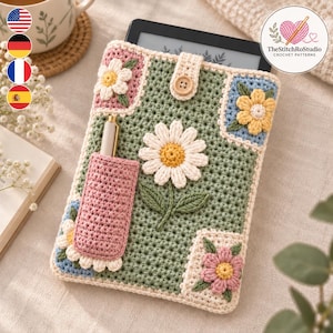 May include: A sage green crochet e-reader sleeve featuring a large white daisy appliqué, a pink pen holder pocket, and smaller floral square motifs in yellow, pink, and blue. The sleeve includes a cream-colored button closure strap at the top.