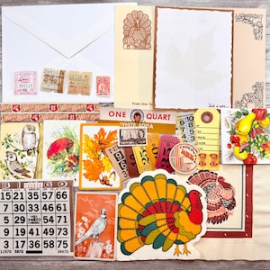 May include: A selection of vintage ephemera, including bingo cards, postcards, and tickets, arranged on a wooden surface. The items feature illustrations of owls, turkeys, and autumn leaves, with a colour palette of orange, yellow, and brown.