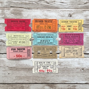 May include: A collection of ten vintage-style paper admission tickets in various colors including red, orange, yellow, light green, blue, pink, tan, and white. Each ticket features unique theater names, locations, and printed admission prices.