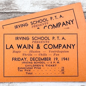 May include: Two orange vintage tickets from Irving School P.T.A. for a La Wain & Company show. The tickets list the date as Friday, December 19, 1941, and include details about the performance, such as magic, illusion, and ventriloquism.