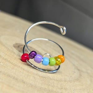 handmade fiddle ring, colourful chakra ring, anxiety relief ring, adjustable fidget ring, stress management, beaded stress relief