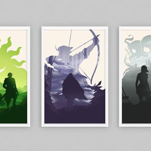 May include: Set of three framed art prints featuring stylized silhouettes of figures in landscapes. The first print shows two figures in a green landscape with a sun and moon. The second depicts an archer. The third shows a warrior.