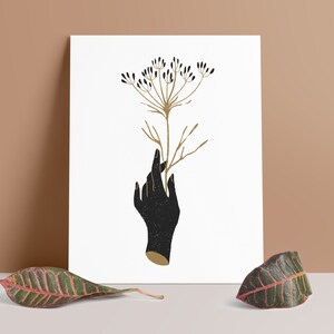 Stampa artistica di illustrazione moderna della pianta di cumino, mano che tiene una pianta di spezie, nero e oro
