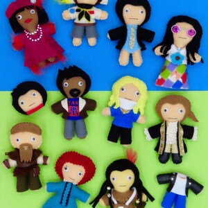May include: A collection of handmade felt dolls, each depicting a different character. The dolls feature various outfits and accessories, including hats, glasses, and jackets. The dolls are arranged on a blue and green background.