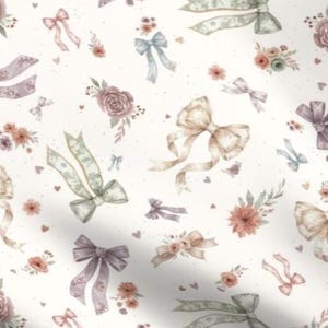 May include: A white fabric with a repeating pattern of watercolor bows, ribbons, and floral arrangements in pastel colors. The bows are in shades of beige, lavender, and green, with small flowers and hearts scattered throughout the design.