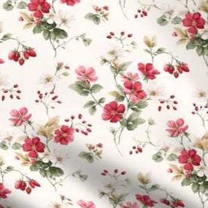 May include: A fabric featuring a repeating pattern of small red strawberries, white strawberry blossoms, and green leaves on a cream-colored background. The design includes clusters of berries and flowers arranged in a scattered, organic layout.