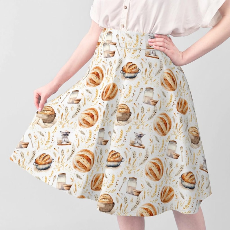 Woman wearing a handmade dress sewn from earthy farmhouse bread fabric with French sourdough loaf and grain pattern, ideal for cottagecore and bakery lover style