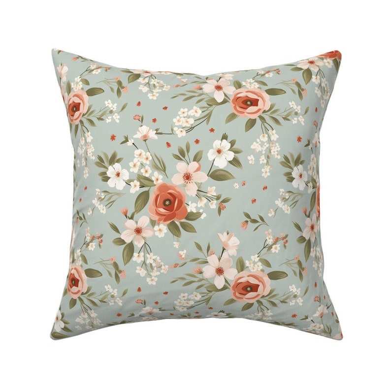 Pastel green floral fabric with peach flowers