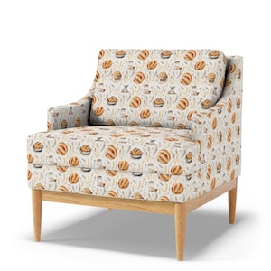 Chair upholstered in earthy French sourdough bread fabric with vintage beige loaf, wheat, and grain print, perfect for rustic farmhouse or countryside kitchen seating