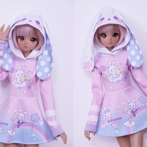 Dress for Smart Doll that has a hood with bunny ears and features bunnys and rainbows on fabric design