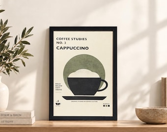 May include: A framed wall art print titled COFFEE STUDIES NO. 3 CAPPUCCINO. The print features a black coffee cup with white foam against a sage green circle on a cream background. Text includes BOLD BELOW SOFT ABOVE and GRAPHIC STUDIES IN COFFEE CULTURE.