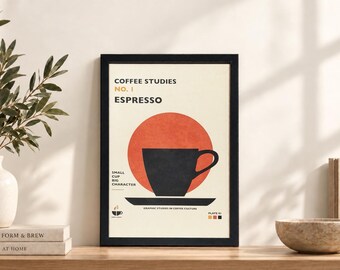 May include: A framed wall art print titled Coffee Studies No. 1 Espresso. The graphic features a black coffee cup and saucer centered over a large orange circle on a cream background. Text includes Small Cup Big Character and Plate 01.