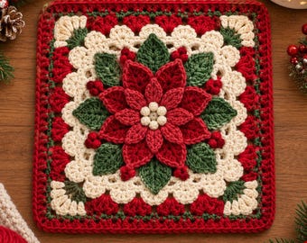 May include: A square crochet motif featuring a central red poinsettia flower with green leaves and small white berries. The design is framed by layers of cream and red yarn, creating a textured, floral pattern with a festive color palette.