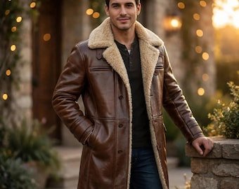 May include: A brown leather coat featuring a thick beige shearling lining and a wide notched collar. The coat has a button-front closure, long sleeves, and two side pockets. It is worn over a dark-colored henley shirt and blue jeans.