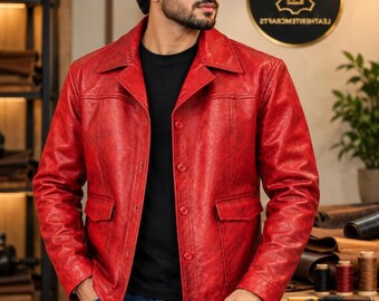 May include: A vibrant red leather jacket featuring a classic collar, long sleeves, and a button-front closure. The jacket includes two front flap pockets at the waist and displays a textured finish throughout the material.