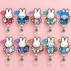 May include: Ten acrylic badge reels featuring white cartoon rabbits dressed in various medical uniforms. Each rabbit is paired with a specific medical department label including ER, ICU, PEDS, MED, SURG, L&D, RAD, PHARM, LAB, and RN, along with related medical equipment.