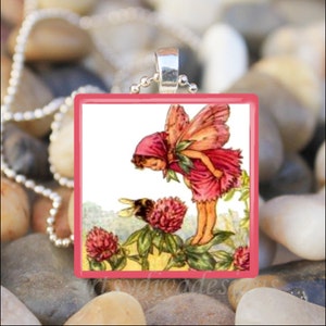 May include: A pink fairy with wings and a red dress is looking at a bee on a clover flower. The fairy is standing on a green stem with other clover flowers. The image is on a white background.