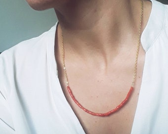 Simple and delicate coral necklace. Red coral and golden chain. Brass chain