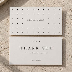 May include: Two rectangular off-white cards with black text and dot patterns. The top card features a grid of dots and the text a little note of thanks. The bottom card displays three dots, the text THANK YOU, Your order made our day, and YOUR BRAND.