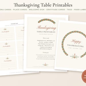 May include: A set of Thanksgiving table printables featuring menu cards, place cards, a welcome sign, gratitude cards, tags, and food labels. The documents have a cream background with autumn-colored leaf wreaths and text in brown and red.