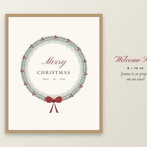 May include: An 8 x 10 inch rectangular sign with a tan border featuring a green pine wreath illustration with red berries and a red bow. The text reads Merry CHRISTMAS and PEACE JOY LOVE. To the right, the text reads Welcome Sign 8 x 10 IN.