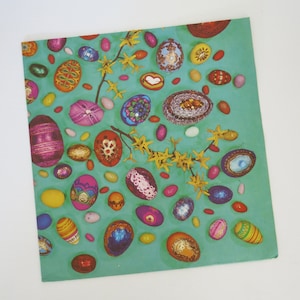 May include: A teal background is covered with colorful Easter eggs of various sizes and designs. Some eggs are decorated with patterns, while others have glitter or floral accents. Yellow flowers and small candies are scattered throughout.