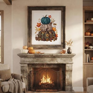 May include: A framed wall art print featuring a stack of three pumpkins. The top pumpkin is teal, the middle is white and grey plaid, and the bottom is dark with a sunflower pattern, all surrounded by autumn leaves, wheat, and pinecones.
