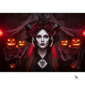 May include: A headpiece featuring dark red and black roses, curved black horns, and white skeletal hand accents. The accessory is worn with a black garment featuring a central silver-toned pendant with an intricate, dark, ornate design.