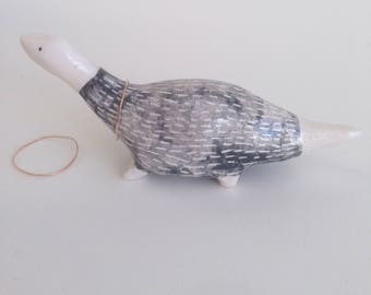 Dinosaur wearing jumper ring cone.