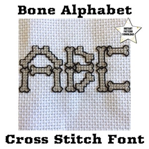 May include: Cross stitch pattern for the letters A, B, and C, designed to look like bones. The letters are stitched in gray and black thread on white Aida cloth. The text "Bone Alphabet Cross Stitch Font" is at the bottom of the image.  The text "Instant Pattern Download" is in a gold star at the top right of the image.