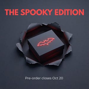 May include: A black square box with a glowing red bat icon on the lid, centered within a circular torn paper effect. The text THE SPOOKY EDITION appears in red at the top, and the text Pre-order closes Oct 20 is printed at the bottom.
