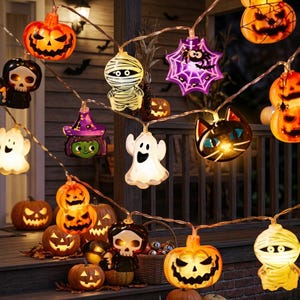 May include: A string of Halloween-themed LED lights featuring various illuminated figures including orange jack-o'-lanterns, white ghosts, mummies, a purple spider web with a spider, a green witch hat, and a black cat face, all connected by a thin wire.