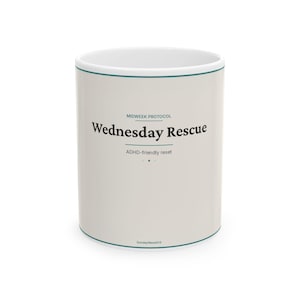May include: A light beige ceramic mug with a teal rim and base. The text reads: MIDWEEK PROTOCOL, Wednesday Rescue, ADHD-friendly reset, and SundayResetOS. The design features clean lines and minimalist typography centred on the front surface.