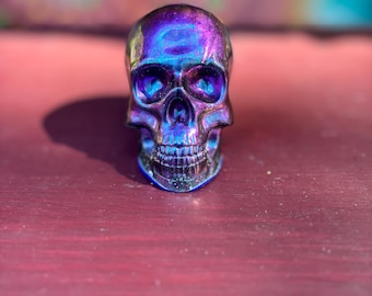 Chameleon colored skull paperweight.