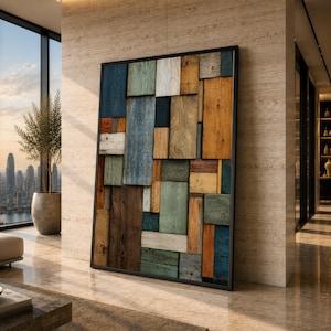 Peut inclure: Une œuvre d'art murale rectangulaire composée de diverses planches de bois disposées en mosaïque. Les planches présentent une finition vieillie dans des tons de bleu, vert, brun, blanc et bois naturel, le tout encadré par un fin cadre noir.