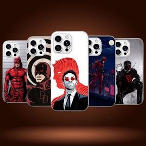 May include: Five smartphone cases featuring various artistic depictions of the character Daredevil. The designs include a red-suited figure, a black-suited figure with a logo, a man in a suit with red glasses, and a dark city rooftop scene.