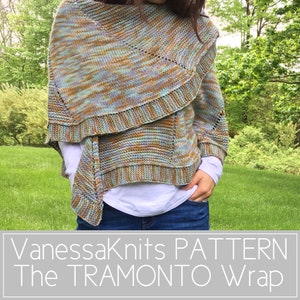 May include: A woman wearing a blue, green, and brown knit shawl with a lacy pattern. The shawl is called "The Tramonto Wrap" and is a VanessaKnits pattern.