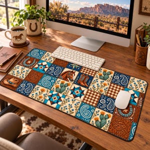 May include: A rectangular desk mat featuring a patchwork design of western-themed illustrations including horses, cowboy boots, hats, cacti, horseshoes, paisley patterns, and geometric quilt-like squares in shades of brown, blue, and cream.