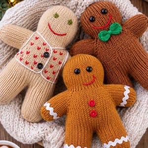 May include: Three knitted gingerbread-style dolls. One is light beige with a red heart-patterned vest and two black buttons. Another is brown with a green bow tie. The third is golden brown with two red buttons and white rickrack trim.