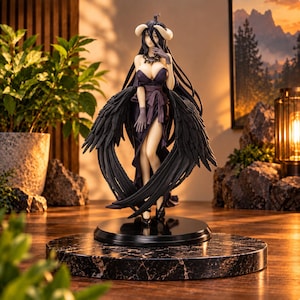 May include: A detailed anime-style figurine of a character with long black hair, curved horns, and large black feathered wings. The figure wears a dark purple strapless dress with a high slit, a dark necklace, and gloves, standing on a black circular base.