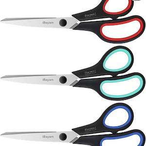May include: A set of three scissors with silver metal blades and black handles featuring colored inner grips in red, teal, and blue. Each pair of scissors has the brand name iBayam printed on the blade and a 3 pack label in the corner.