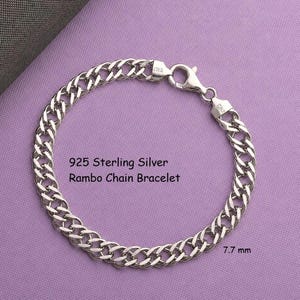 May include: A 925 sterling silver Rambo chain bracelet with a lobster claw clasp. The metal links are polished and reflective. The text 925 Sterling Silver Rambo Chain Bracelet is printed in the center, and 7.7 mm is printed near the bottom right.