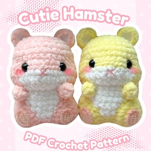 May include: Two plush hamster toys made of soft yarn, one light pink and one light yellow, both with white bellies, black eyes, and pink cheeks. The text Cutie Hamster PDF Crochet Pattern By Mireye Creations is displayed in white lettering.
