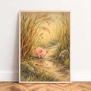 May include: A framed wall art print featuring a small pink pig standing on a dirt path surrounded by tall golden grasses and green foliage. The pig looks down at its own reflection in a small puddle of water on the ground.