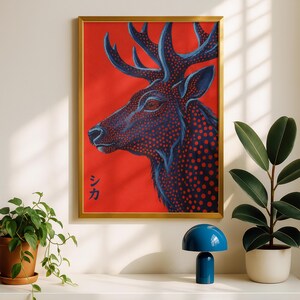 May include: A framed wall art print featuring a profile view of a deer head against a solid red background. The deer is rendered in dark blue with a pattern of red dots throughout its form. The Japanese characters シカ are printed in blue.