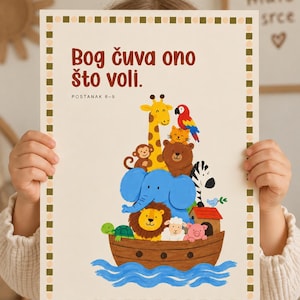 May include: A rectangular wall art print featuring a brown wooden ark on blue waves, filled with a stack of cartoon animals including a giraffe, elephant, lion, and bear. The text reads "Bog čuva ono što voli." and "POSTANAK 6-9" in brown.